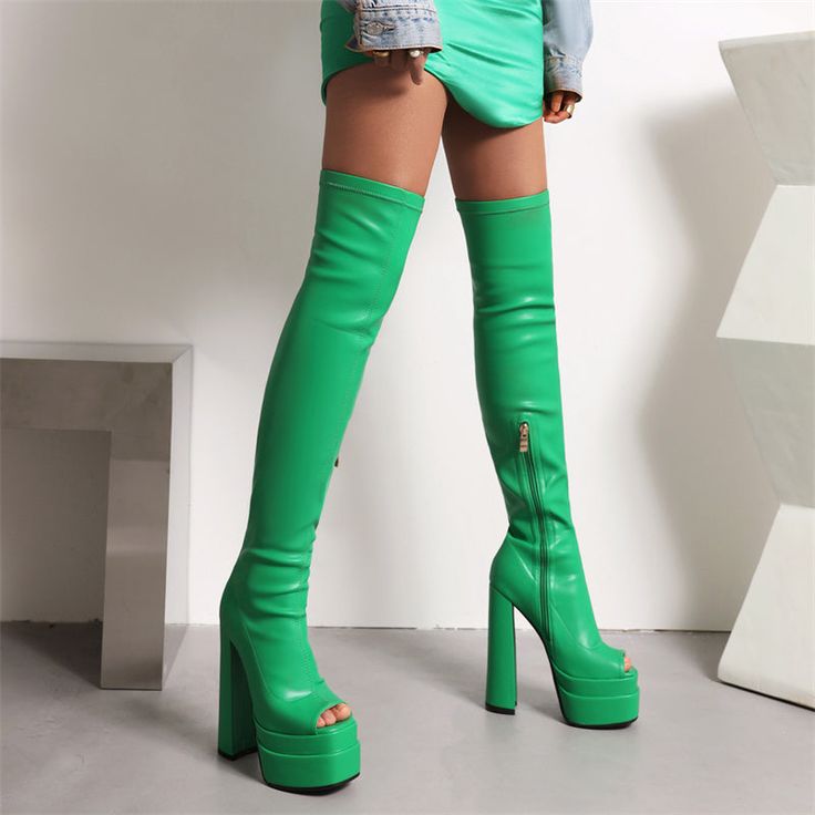 Looking for a fashion-forward and unique boot that will turn heads? Look no further than our gorgeous green thigh high boots! These stylish boots feature an open toe design and platform block heels for a look that's both fashionable and comfortable. Whether you're dressing up for a night out or just looking to add a pop of color to your outfit. these boots are sure to make a statement. Upper: Microfiber Lining: Leather Outsole: Rubber Toe: Open Toe Closure: Zip Heel: 14.5cm/6'' Platform: 5cm/5'' Trendy Platform Knee-high Boots, Spring Knee-high Chunky Platform Boots, Spring Chunky Platform Knee-high Boots, Trendy Fitted Knee-high Boots With Chunky Platform, Spring Platform Knee-high Boots With Block Heel, Spring Knee-high Chunky Platform Heeled Boots, Spring Chunky Platform Knee-high Heeled Boots, Green High Heel Boots For Winter, Spring Knee-high Heeled Boots With Chunky Platform