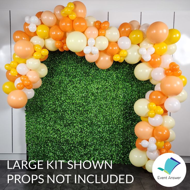 an arch made out of balloons and grass with the words large it shown propps not included