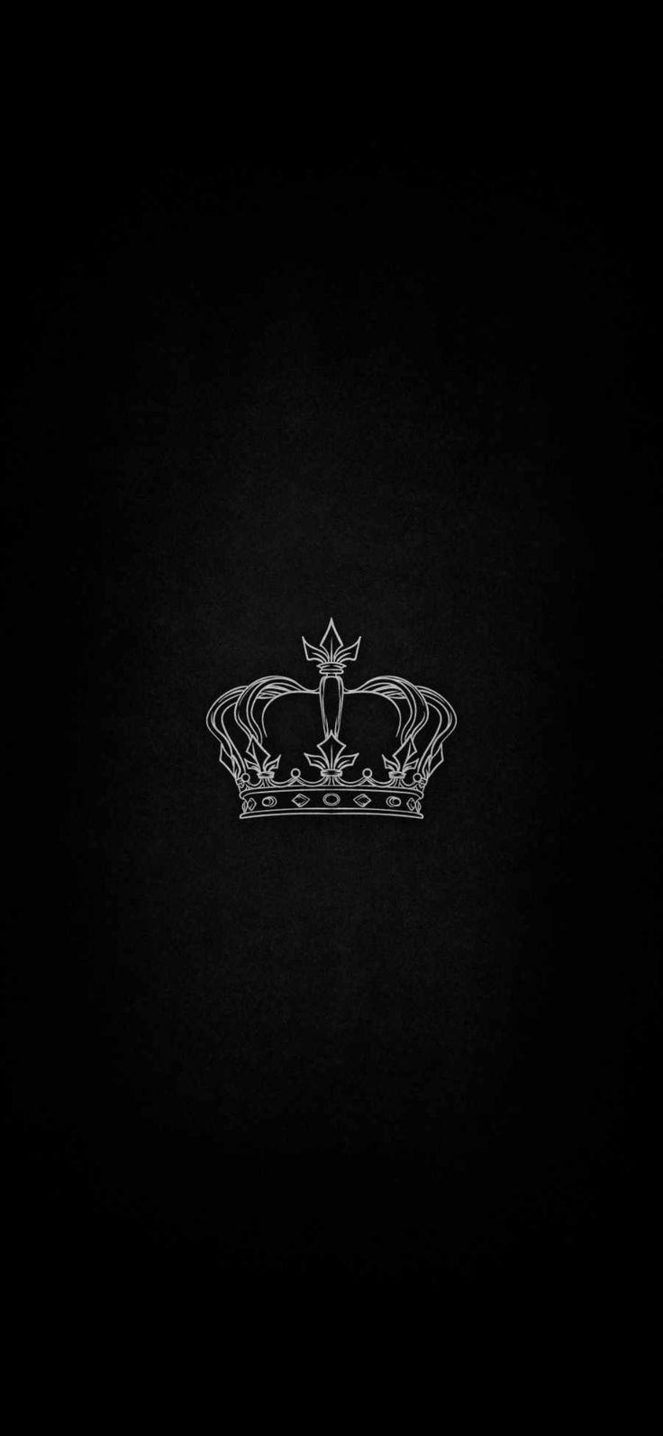 a black and white photo of a crown on a dark background with the word king written across it