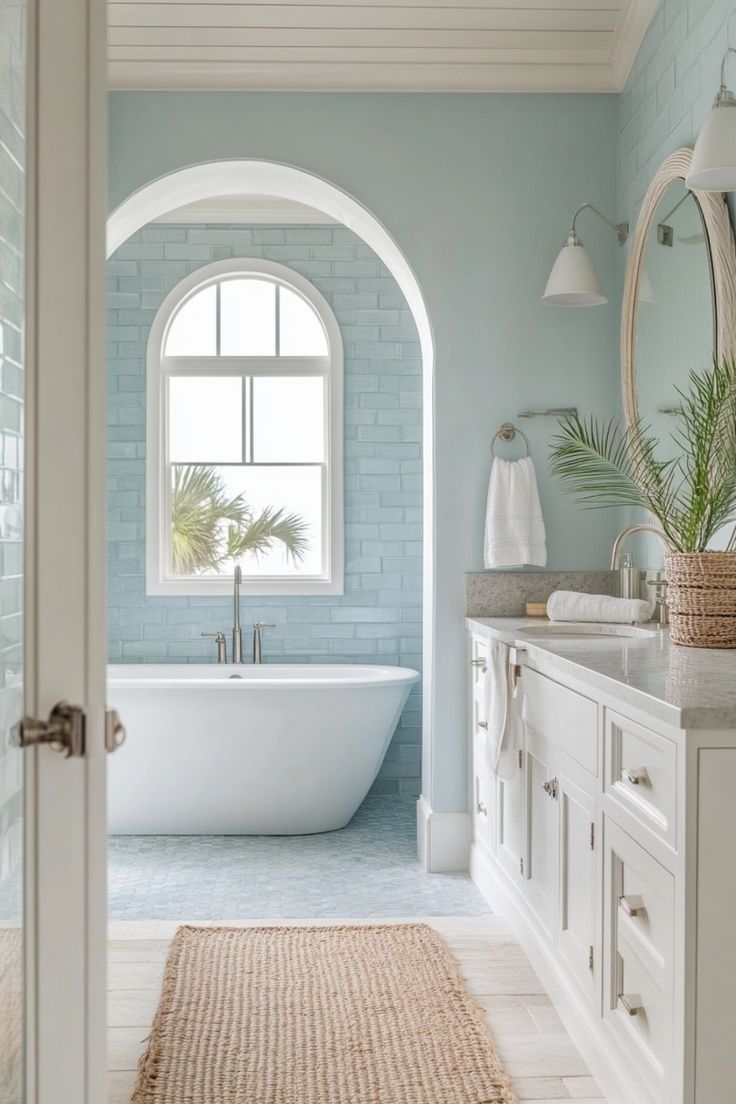 a bath room with a tub a sink and a mirror on the wall in front of a window