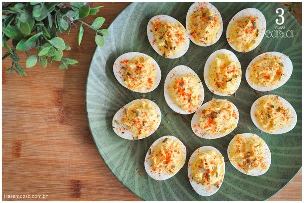 deviled eggs are arranged on a green plate