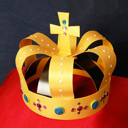 a paper crown with a cross on it