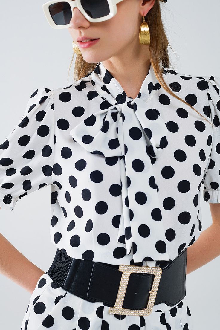 Subcategory: Blouse. Collar: High collar neckline. Sleeves: Short Sleeves. Print: Polka-dot print. Fit: Standard fit. Style: Daily. Fabric: Lightweight woven fabric . Product details: Knot detail. runs true to size. S. 100% Polyester Trendy Tie Neck Office Tops, Trendy Tie Neck Top For Office, Polka Dot Short Sleeve Blouse For Work, Spring Polka Dot Blouse With Collar, Fitted Polka Dot Blouse For Work, Summer Fitted Tie Neck Blouse, Trendy Tie Neck Blouse For Office, Elegant Polka Dot Blouse For Party, Fitted Tie Neck Blouse For Summer