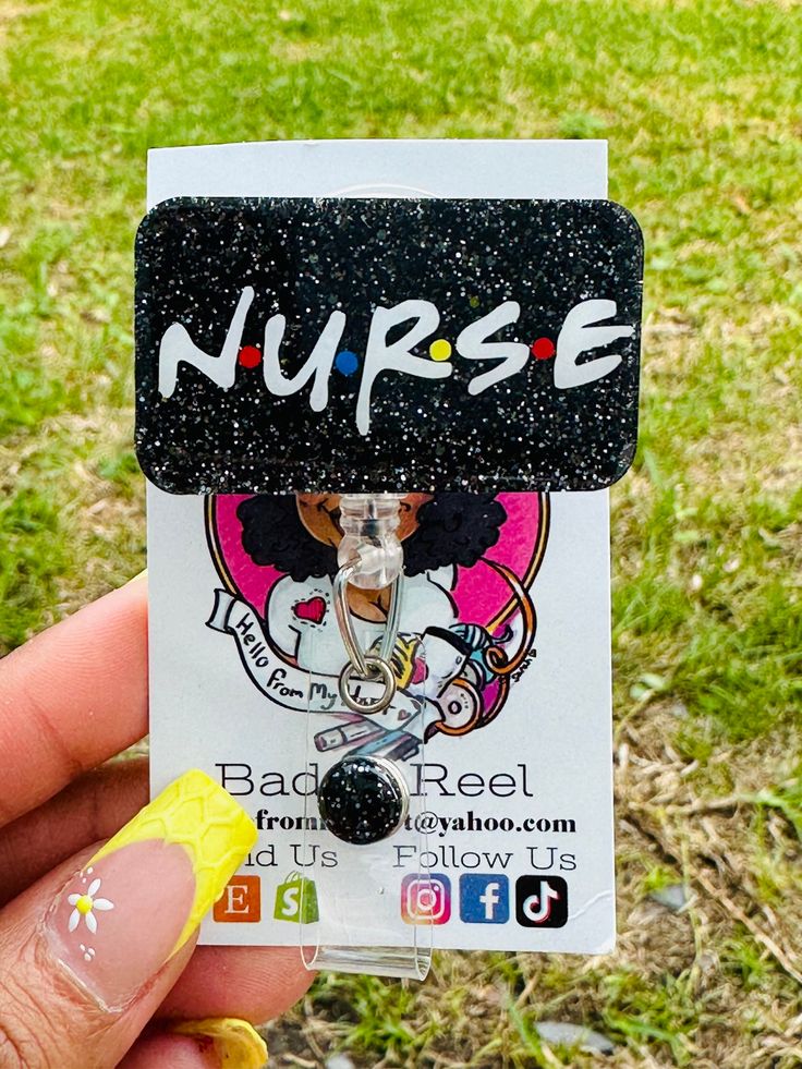 someone is holding up a card with the word nurse on it in front of some grass