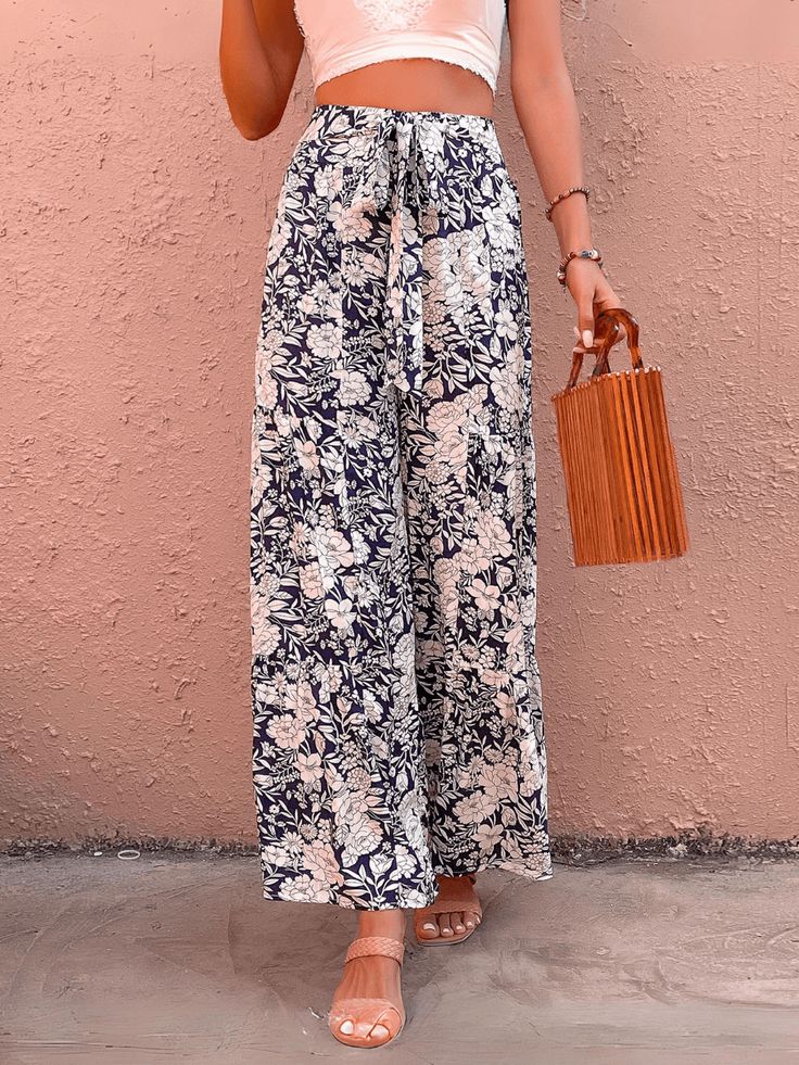 Unleash your inner fashionista with our Cancun Printed Wide Leg Belted Pant! Perfect for a day at the beach or a night out, these pants feature a fun print and a belted waist for a flattering fit. Say goodbye to boring pants and hello to style and comfort! Size Guide: Model is 5’6” tall, and has a 32.2” bust, 24.1”waist, & 35.6” hips. She is wearing a S / US 4 / AU 8. This pants is true to size. Material: 100% Rayon Feature: High rise. Belted Tie. Wide leg. Floral Printed. Back zipper closure. Relax Fit. Not lined. Care Instructions: Machine wash / Cold hand wash Chic Vacation Bottoms With Belt, Summer Printed Bottoms For Brunch, High Waist Floral Print Vacation Pants, Printed Summer Bottoms For Brunch, Chic Belted Vacation Bottoms, Chic Belted Bottoms For Vacation, Chic Floral Print Pants For Day Out, Chic Printed Vacation Pants, Trendy Floral Print Vacation Pants