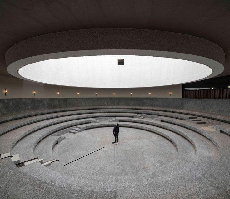 a person standing in the middle of a circular room