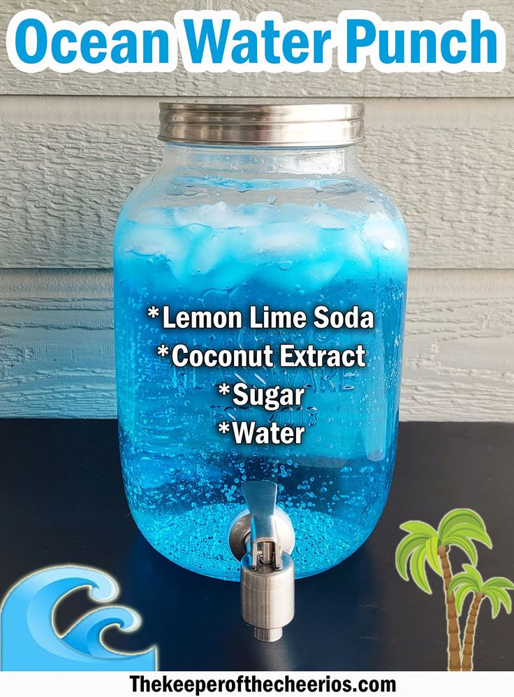 a mason jar filled with lemon lime soda sits on a table next to a water pump