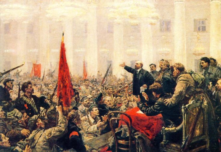 an image of a crowd of people in the street with one person holding up a red flag