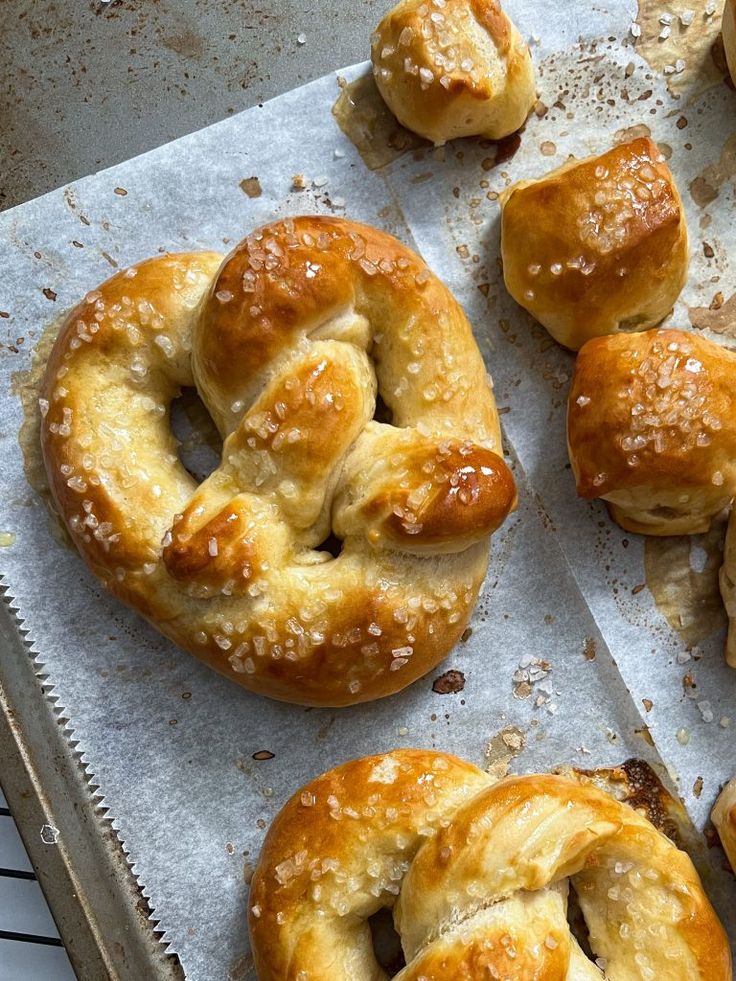 freshly baked pastries sitting on top of a baking sheet, ready to be eaten