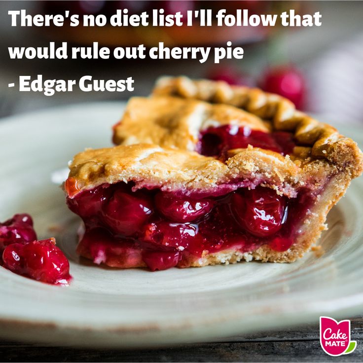 a piece of pie on a plate with cherries