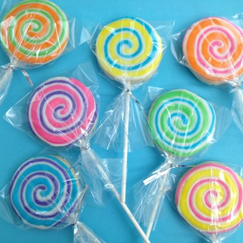 lollipops wrapped in cellophane on a blue background