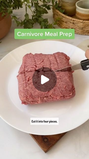 a person cutting meat on top of a white plate