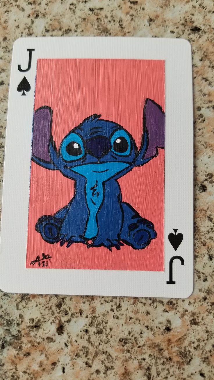 a playing card with an image of stitch on it