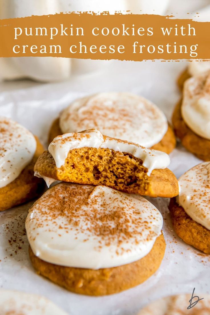 pumpkin cookies with cream cheese frosting on top