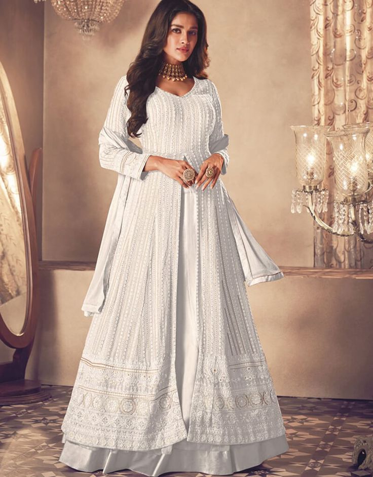 White Lehenga style Suit Semi-Stitched Suits Salwar Kameez in Embroidery, Sequins & Lace Work:Arabic Attire #indiansuitsonlineindia #designersalwarkameezonline #whatissalwar #salwarkameezpatterns #designasuit #kameezkurta #indiansuitneckdesigns #latestdesignerssuits #floralindiansuit #buychuridarsonline #turquoisesuitforladies #printedsuitforladies #salvarpatterns #salwarkameezwithdupatta #floralindiansuits #salwarkameeznecklinedesigns Luxury White Unstitched Suit For Traditional Ceremonies, Luxury White Bohemian Salwar Kameez, Luxury White Anarkali Salwar Kameez, Luxury White Salwar Kameez With Cutwork, Luxury White Salwar Kameez For Reception, Luxury White Salwar Kameez For Transitional Season, Luxury White Georgette Unstitched Suit, Luxury White Unstitched Suit With Lace Work, Luxury Fitted White Salwar Kameez