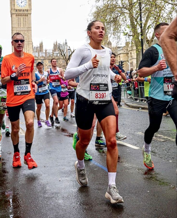 a group of people that are running in the street