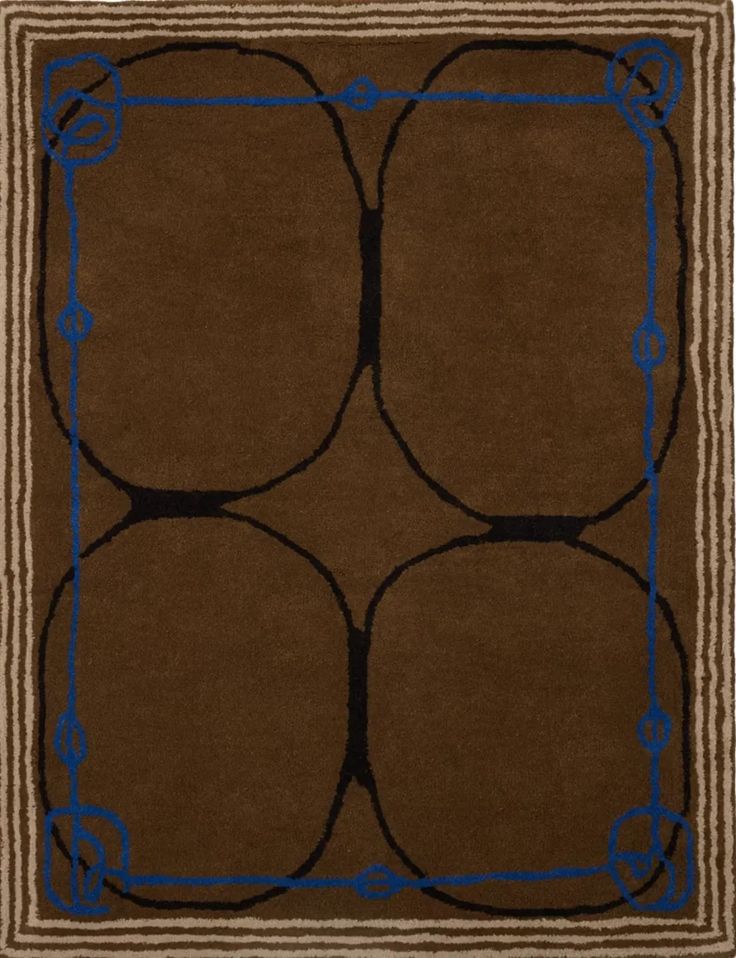 a brown rug with blue accents on the edges and an interlocked circle design