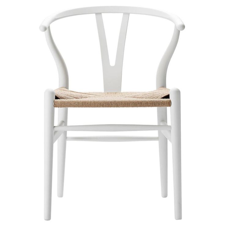 a white wooden chair with a woven seat