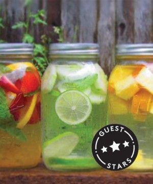 four mason jars filled with different types of fruit