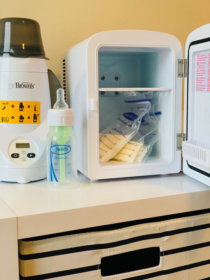 an open refrigerator sitting on top of a counter