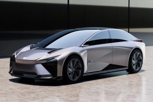 an electric car parked in front of a building