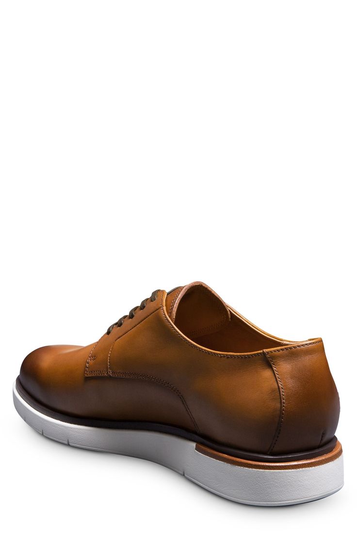 A rich leather upper and streamlined silhouette lend timeless sophistication to a versatile derby grounded by a durable rubber sole. Removable, cushioned insole with arch support Leather upper and lining/rubber sole Imported Derby Oxfords With Branded Insole And Calf Leather, Calf Leather Oxfords With Branded Insole For Derby, Modern Calf Leather Oxfords For Derby, Leather Moc Toe Dress Shoes With Contrast Sole, Moc Toe Dress Shoes With Contrast Sole For Business, Modern Leather Derby Shoes With Plain Toe, Business Oxfords With Contrast Sole In Calf Leather, Business Oxfords With Calf Leather And Contrast Sole, Luxury Oxfords With Contrast Sole And Plain Toe