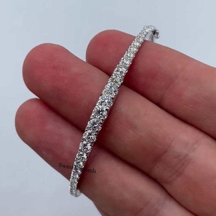 Moissanite Wedding Bangle, Round Colorless Diamond Half Eternity Band, Diamond Bangle For Women & Girl's, 18K Gold Bangle, Anniversary Gift ❁Description❁ Moissanite & Simulated Stone: ----------------------------- Stone Shape: Round Cut Stone Size: 4.50 mm, 4 mm, 3.50 mm Weight: 7.68 TCW Color: Colorless Cut: Excellent Clarity: VVS ❁ You Can be Planning to place your custom order, Then Do it by onwards. ↣ handmade moissanite made by craftsman with full of festinating and brilliance. As well Stone is produced with excellent cuts, grades and superior quality for our customers. ↣ Metal Preference: 925 Sterling Silver/10KT/14KT/18KT ↣ Metal Tones: Yellow Gold, White Gold, Rose Gold ❁ Stone types & choices: ↣ Natural Diamond, Lab-grown diamond, Precious and semi-precious gemstones ❁ Stone Shape Diamond White Brilliant Cut Bangle, Classic Cubic Zirconia Crystal Bracelet For Wedding, Dazzling Brilliant Cut Crystal Bracelet For Anniversary, Formal Silver Bangle With Prong Setting, Dazzling Brilliant Cut Bangle Jewelry, White Gold Brilliant Cut Bangle Jewelry, Dazzling Anniversary Bangle With Jubilee Bracelet, Brilliant Cut White Gold Bangle Jewelry, Dazzling Adjustable Bangle Bracelet