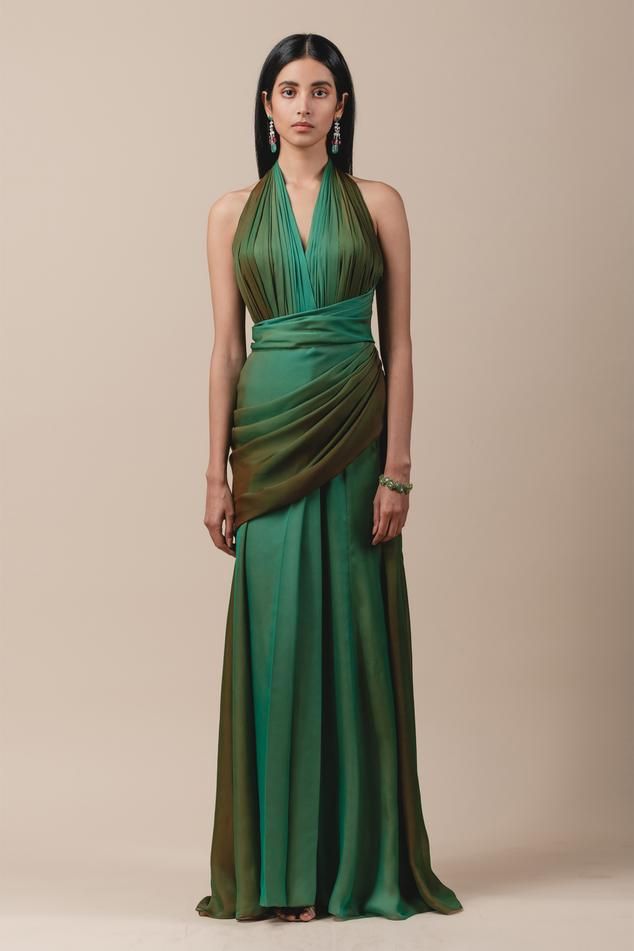 Green ombre draped saree gown with halter neck and trail detail.
Component: 1
Neckline: Halter
Sleeve Length: Sleeveless
Fabric: Georgette
Color: Green
Draped gown
Backless detail - Aza Fashions Gown Draping, Concept Saree, Draped Saree Gown, Sari Gown, Pretty Gowns, Saree Gowns, Draped Gown, Georgette Gown, Draped Saree