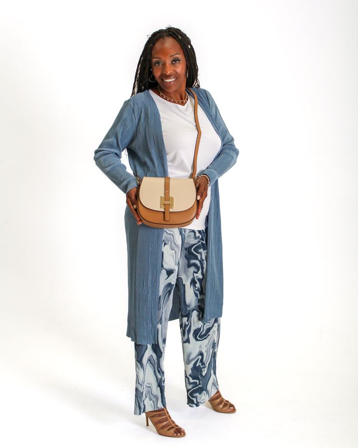 Our Ribbed Long Cardigan is the perfect addition to your wardrobe. This cardigan features ribbed fabric and long sleeves, making it perfect for the office or a night out. Enjoy fashion and convenience with this one-of-a-kind, travel-ready piece. Want to be comfortable and chic all day? Try our Ribbed Long Cardigan! Complete the look: Shop Ribbed Flare Pants (Black & White) Shop Ribbed Flare Pants (Multi Blue) Shop Keyhole Sleeveless Top Cardigan's product details: Length: S: 41", M: 42", L: 43" Ribbed Flare Pants, Free Pants, Ribbed Flares, Faux Leather Handbag, Leather Handbags Tote, Women Pants, Cardigan Tops, Wrinkle Free, Ribbed Fabric