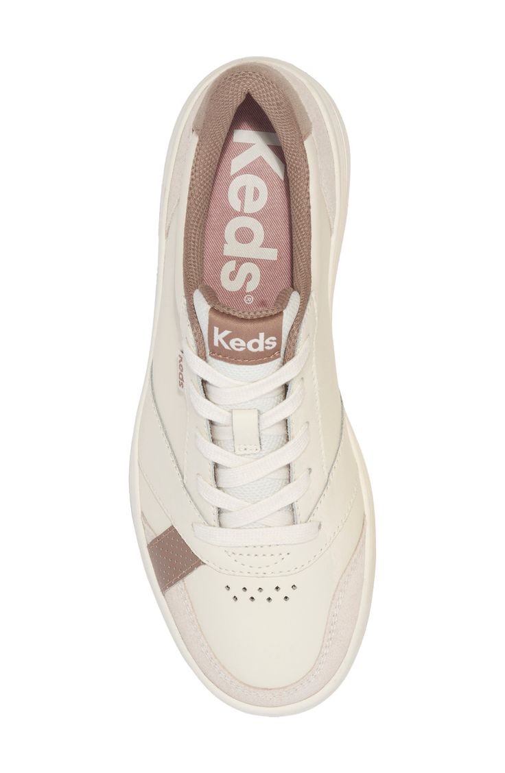 Change up your everyday ensembles with this sporty sneaker showcasing textural colorblocking and breathable mesh in the lining for comfort. Lace-up style Breathable mesh allows ventilation of excess heat for cooling comfort Leather upper/textile lining/synthetic sole Imported Spring Sporty Slip-resistant Sneakers, Beige Sporty Sneakers With Perforations, Sporty Beige Sneakers With Perforations, Functional Beige Synthetic Sneakers, Spring Slip-resistant Synthetic Sneakers, Comfortable Beige Sneakers With Perforations, Spring Leather Slip-resistant Sneakers, Sporty Beige Synthetic Sneakers, Beige Synthetic Sneakers For Sports