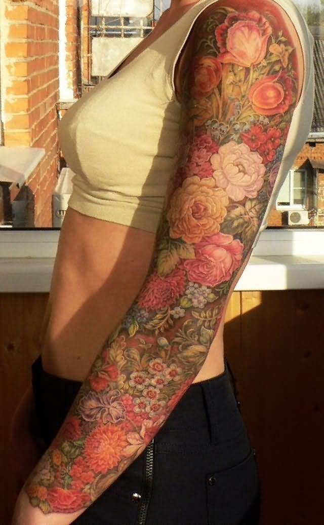 a woman's arm with flowers on it