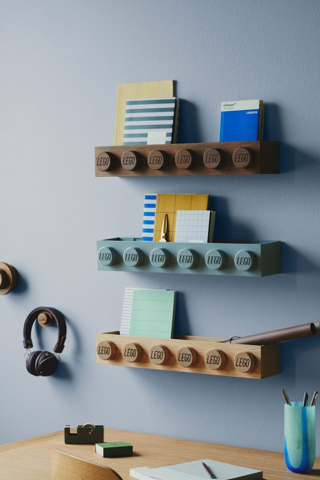 three wooden shelves with office supplies on them