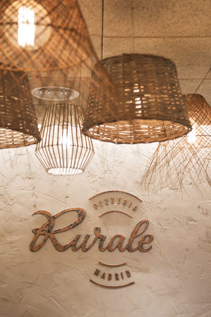 some lights hanging from the ceiling above a restaurant sign that says karrak on it