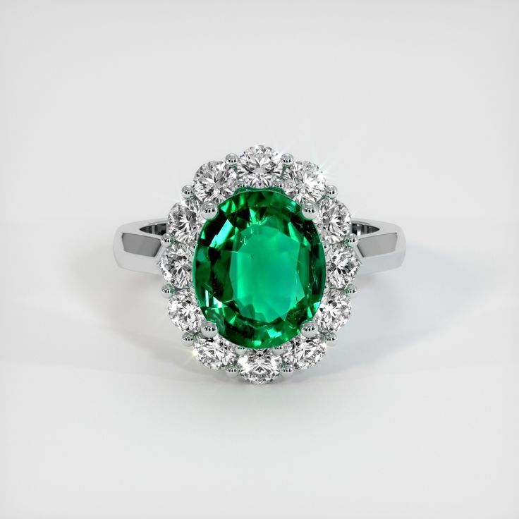 The ring features a beautiful, transparent 2.91 carat oval shape green emerald with the dimensions of 11.10 x 9.33 x 4.77 mm and a mixed brilliant cut. It has a clarity grade of eye clean (evaluated at eye level), vivid color saturation, and an excellent polish. #engagementrings #lovering #promiserings #cuterings #engagementringideas Formal Green Emerald Ring With Halo Design, Oval Emerald Ring With Halo Design, Green Emerald Ring With Halo Round Cut, Classic Green Halo Ring With Brilliant Cut, Classic Green Emerald Ring With Halo, Classic Green Brilliant Cut Halo Ring, Formal Gia Certified Green Halo Ring, Green Oval Diamond Halo Ring, Oval Green Emerald Ring With Center Stone