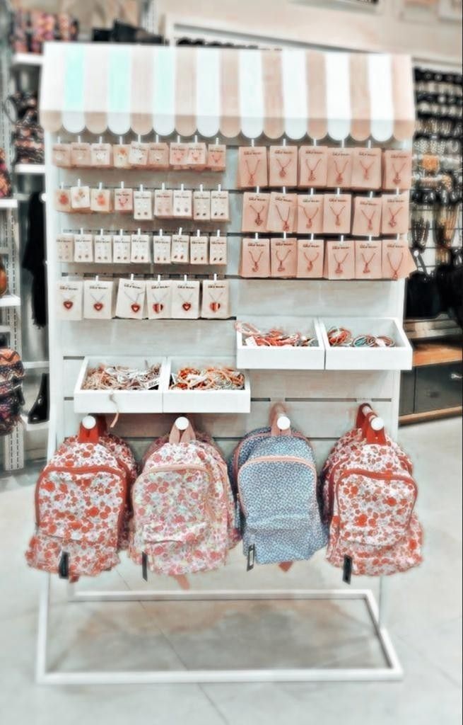 several backpacks are on display in a store