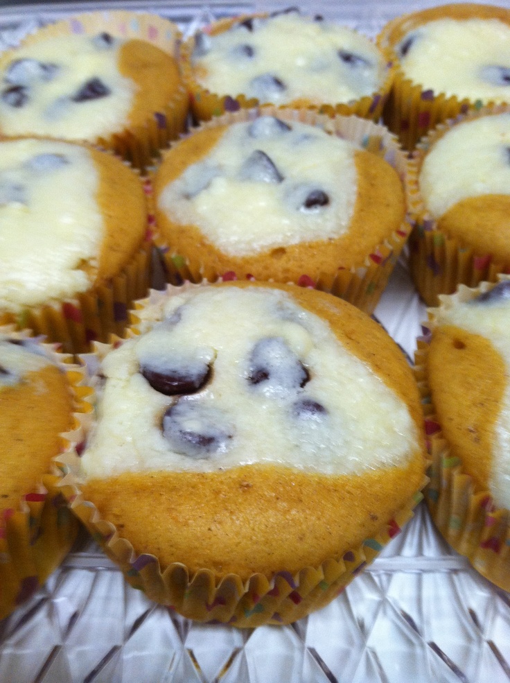 there are many blueberry muffins on the cooling rack in this case,