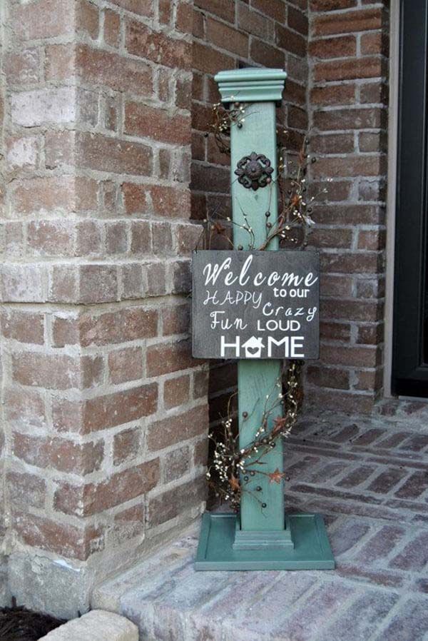 a sign that is on the side of a brick building saying welcome to my home