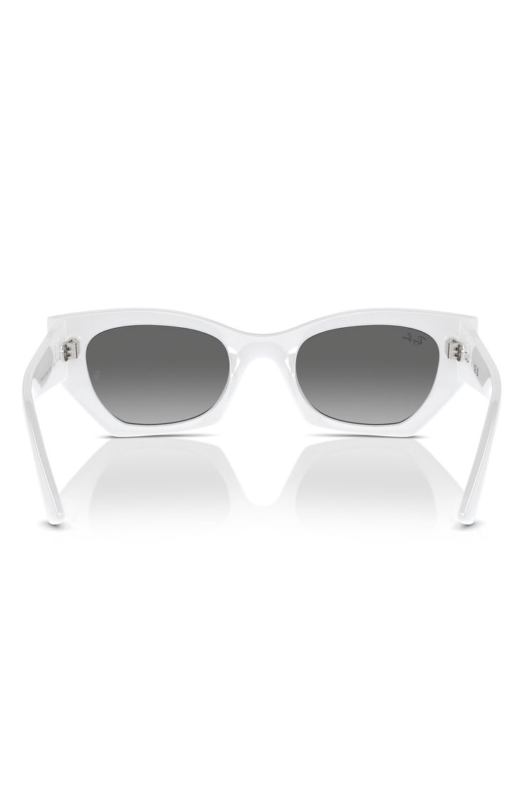 Retro but clearly contemporary, these standout sunglasses will embolden your everyday looks with their fresh geometric shape. 52mm lens width; 22mm bridge width; 145mm temple length 100% UV protection Plastic Imported Modern Optic White Cat Eye Sunglasses With Gradient Lenses, Modern White Cat Eye Sunglasses With Gradient Lenses, Modern White Square Frame Cat Eye Sunglasses, Optic White Sunglasses With Gradient Lenses And Square Frame, Classic Cat Eye Sunglasses In Optic White, Modern Optic White Polarized Cat Eye Sunglasses, Modern Clear Cat Eye Sunglasses With Uv Protection, Modern Clear Cat Eye Sunglasses With Tinted Lenses, Modern Optic White Sunglasses With Tinted Lenses