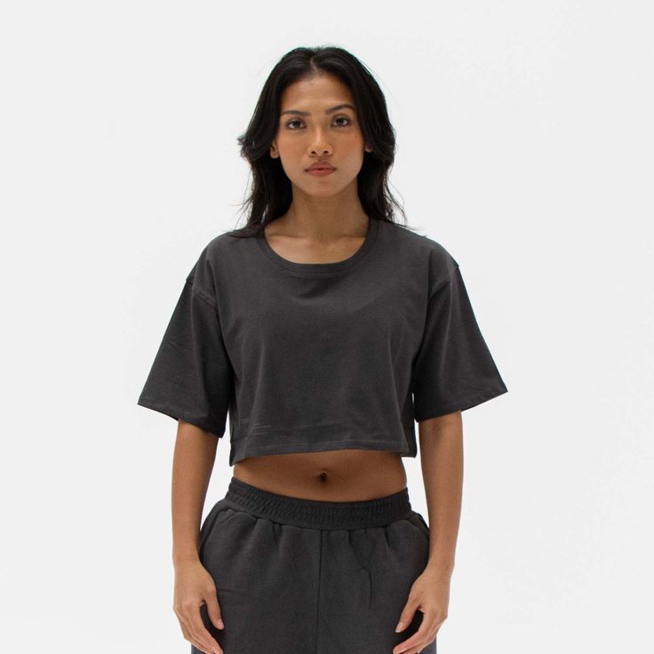 The Easy Crop Top is a must-have essential in your wardrobe. You will love our lightweight organic cotton crop top, which is perfect for your everyday basics. This piece is such a staple throw on our matching comfy sweats for a flawless street look or pair it with your favourite leggings or jeans. Ideal for in the gym and out on the streets. Made from our lightweight organic cotton. 95% organic cotton, 5% Elastane. Dyed with certified Eco-Friendly dyes. GOTS & OEKO-TEX® approved. All packaging is recycled or responsibly sourced. Cotton Athleisure Cropped T-shirt For Workout, Basic Cotton Crop Top For Workout, Cotton Short Sleeve Activewear For Loungewear, Casual Cotton Crop Top For Workout, Boxy Fit Cotton Cropped Shirt With Crew Neck, Everyday Organic Cotton Cropped T-shirt Crew Neck, Everyday Organic Cotton Cropped T-shirt, Everyday Cotton Cropped Hem Tops, Everyday Organic Cotton Crew Neck Cropped T-shirt