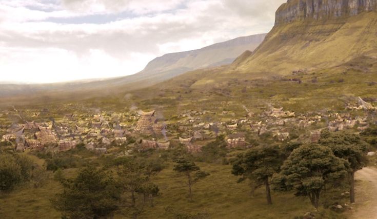 an aerial view of a village in the mountains