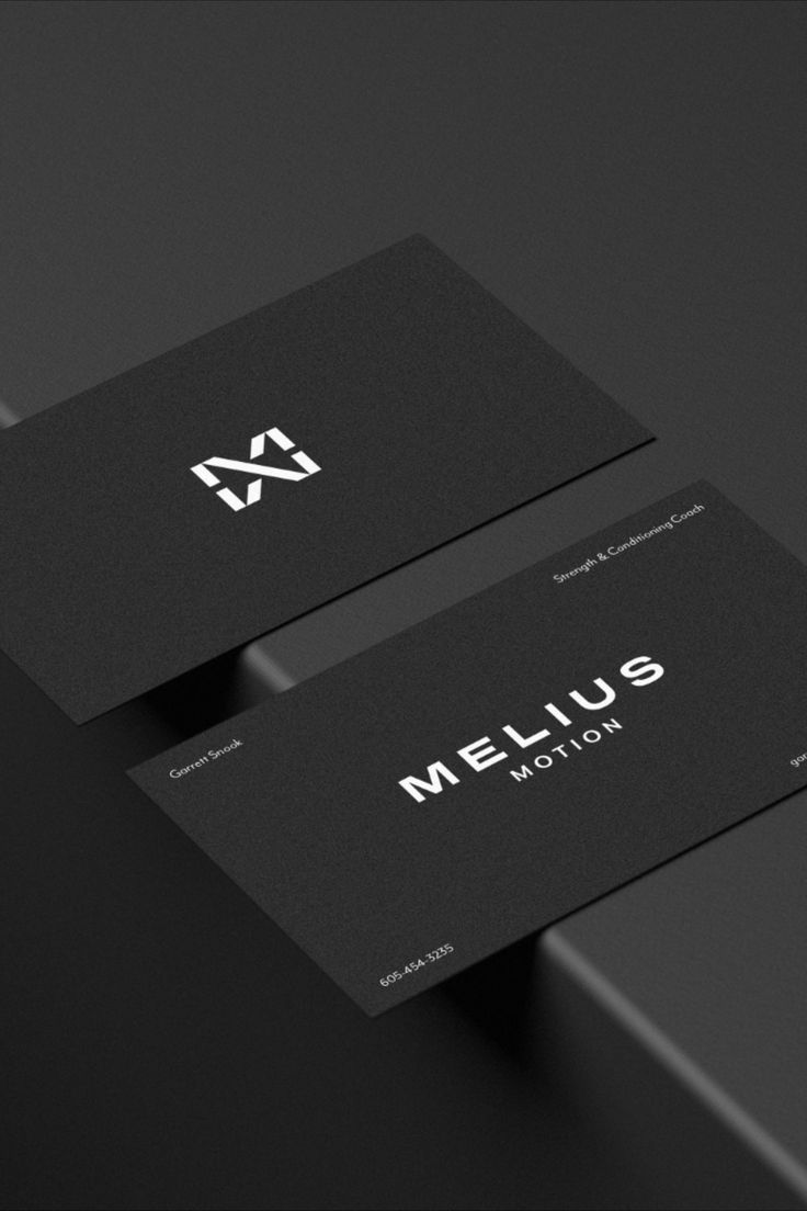 two black business cards with the word melius written on one side and an image of a