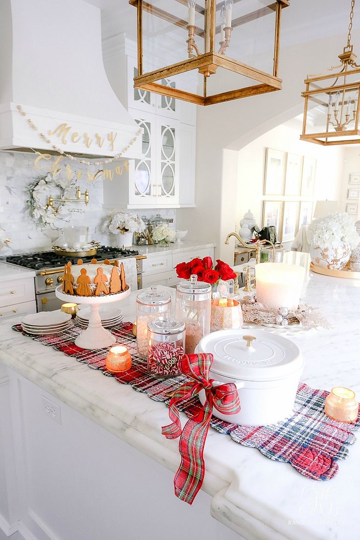 a kitchen counter with candles and plates on it