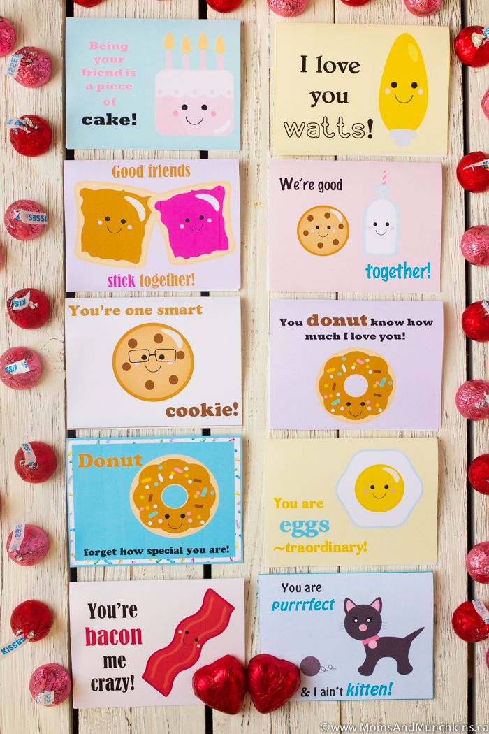 valentine's day cards on a table with candy and candies around the edges