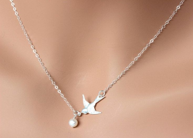 Dove Bird Necklace, Freshwater Pearl Necklace This necklace express for love and friendship All metal components onto High Quality Sterling Silver or 14k gold fill. This beautiful necklace consists of, -Sterling Silver Dove Pendent, -5mm Gem quality Freshwater Pearl and -Sterling Silver cable chain with end to end to Spring Claw. -Come up with beautiful ribbon gift box and -Care instruction pack . MORE BIRD https://www.etsy.com/shop/rainbowearring?ref=hdr_shop_menu&search_query=bird PET LOVE Silver Bird Shaped Jewelry For Gifts, Silver Bird-shaped Jewelry As Gift, Silver Bird-shaped Jewelry For Gift, Elegant Bird Design Jewelry For Gift, Elegant Bird Design Jewelry Gift, Elegant Bird Design Jewelry For Anniversary, Elegant Sterling Silver Necklace With Bird Design, White Bird-shaped Jewelry Gift, Elegant Silver Necklace With Bird Shape