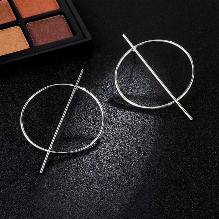 These exaggerated geometric big circle earrings are a stunning addition to your jewelry collection. Crafted with precision and attention to detail, these earrings feature bold shapes and a unique design that will elevate any outfit. Explore our exquisite selection and make a bold fashion statement today. Modern Circular Earrings For Party, Modern Metal Open Circle Hoop Earrings, Elegant Geometric Metal Hoop Earrings, Minimalist Circle Earrings For Party, Modern Geometric Metal Hoop Earrings, Big Circle Earrings, Female Punk, Oversized Earrings, Heart Dangle Earrings