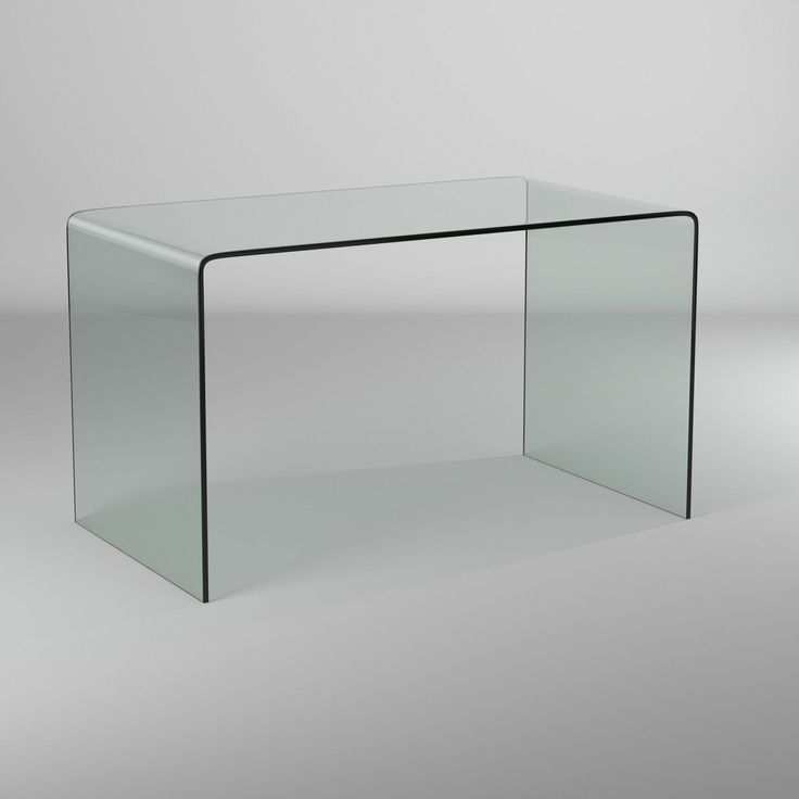 a glass table sitting on top of a white floor next to a gray wall in an empty room