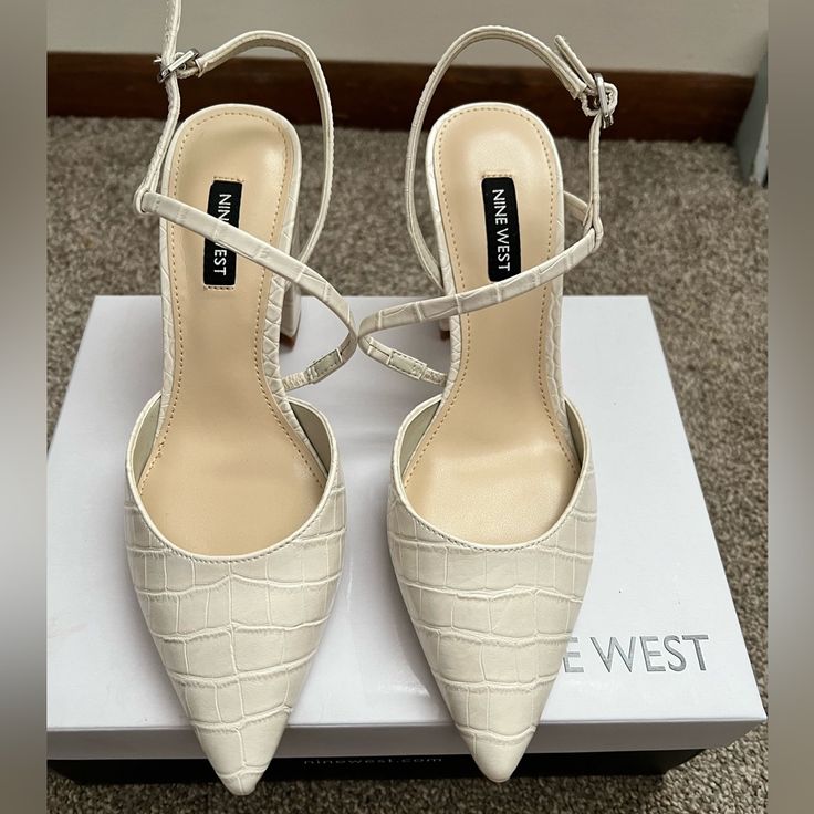 Nine West Heels In Ivory Embossed Leather Size 6.5 Never Worn So These Are Brand New. Purchased From The Website. Cream Heels With Reinforced Heel For Office, Cream Ankle Strap Heels For Office, Cream Pointed Toe Court Shoes With Heel Strap, Cream Court Shoes With Heel Strap And Pointed Toe, White Heels With Heel Strap For Work, White Ankle Strap Heels For Work, Cream Heels With Branded Heel Counter For Office, Cream Pointed Toe Heels With Heel Strap, Cream Almond Toe Heels For Office