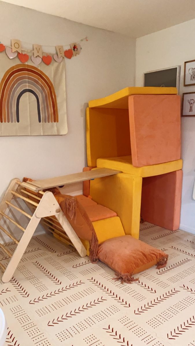 a child's play room with furniture and accessories on the floor, including a ladder