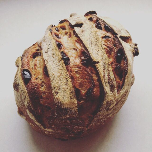 a loaf of bread sitting on top of a white table