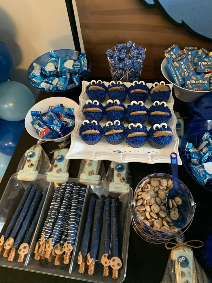 the dessert table is set up with cookies and other treats for an ice age birthday party